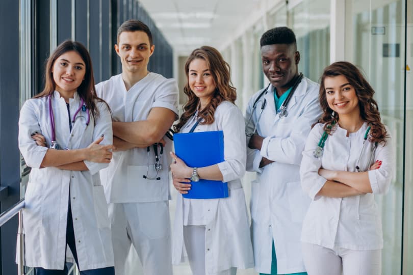 a-group-of-doctors-standing-together-in-a-hospital-hallway
