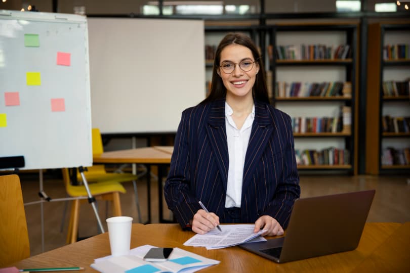 a-professional-woman-in-a-suit-and-glasses-working